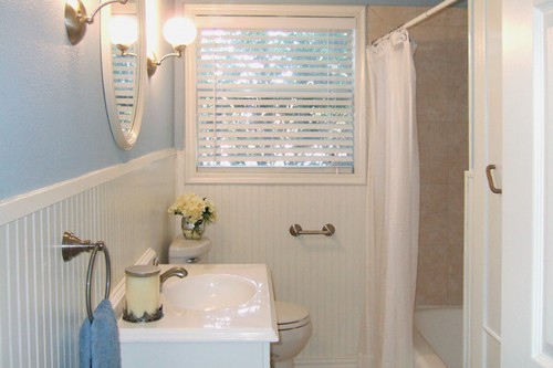 totally remodeled guest bathroom with tiled shower and linen closet
