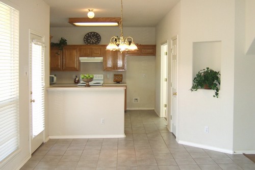 view of the kitchen through the breakfast area