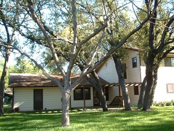 back yard view towards deck and master bedrooms