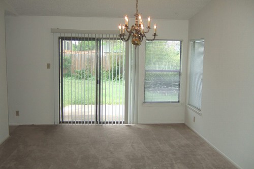 dining area with view of patio and back yard