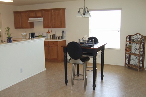 dining area showing part of kitchen - windows have upgraded 1 blinds