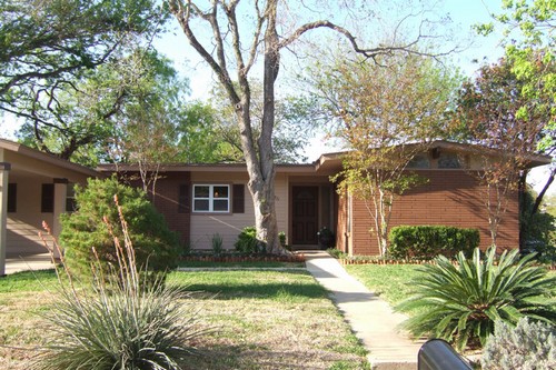 totally updated with a new carport, fresh landscaping and flowers, and privacy fence