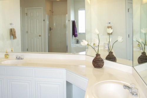 dual vanities, linen closet, and lots of counter space