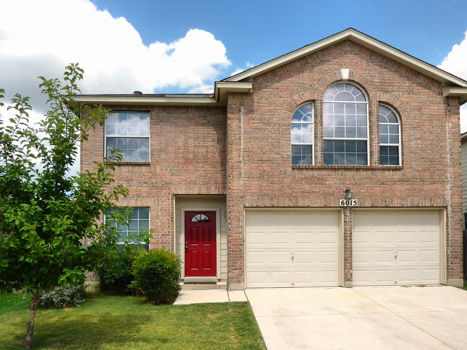 landscaped front with two-car garage