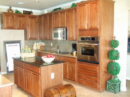 island kitchen opens to family room and breakfast area