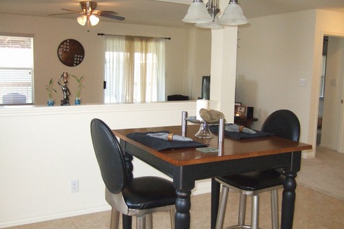 dining area opens to living room and kitchen