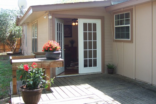 patio doors open from the study to a sunny deck and large back yard