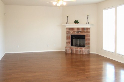 family room with gleaming wood floors and lots of light