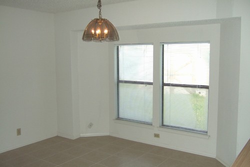 breakfast nook with windows onto back yard