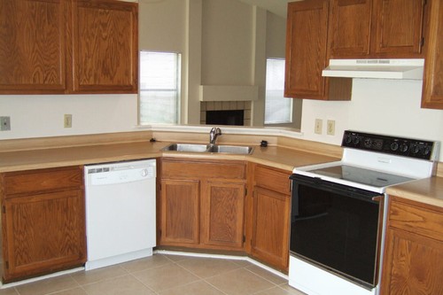 kitchen with view to fireplace in living room